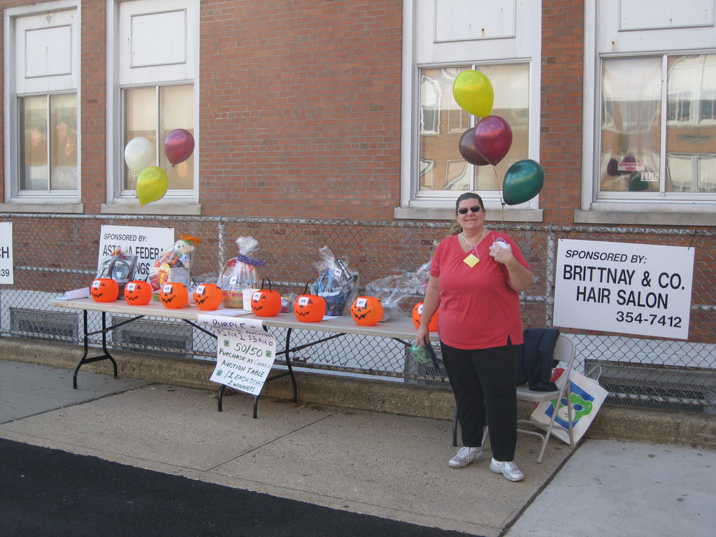 Everyone was all smiles at the Polk Street Fall Festival, including Debbie Paino, with beautiful gift baskets, which were raffled off at the event.