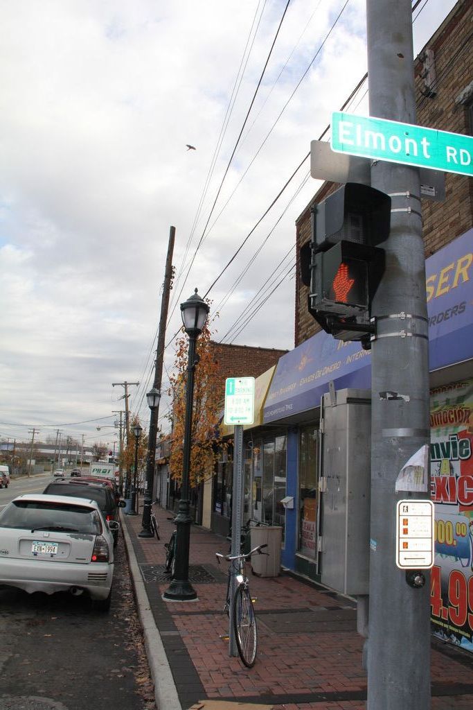 Streetscape work recently completed in Elmont includes new curbs, brick pavers, Victorian-style lighting and trash receptacles.