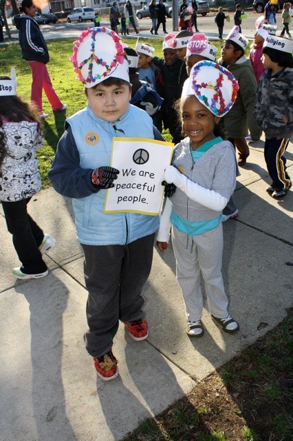 Jose Hernandez, 5, left, and Maya Cherubin, 5, kindergarteners at Clara H. Carlson, made signs and hats for last week's "March Against Bullying."