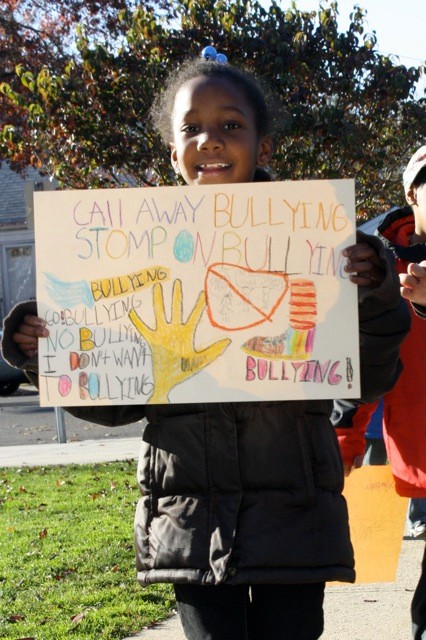 Second-grader Charnelle Miller, 7, showed off the sign she made last week.