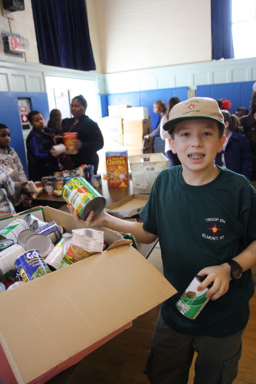Nicholas, a sixth-grader in Troop 294 came to volunteer with the rest of his group at the Dad's Club sponsored food drive in Elmont.