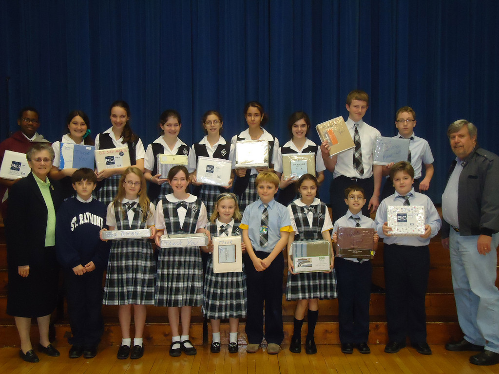Pictured above were some of the members of St. Raymond’s Junior Sodality of Our Lady with pastor Fr. Chuck Romano, at right, and principal Sr. Ruthanne Gypalo, left.