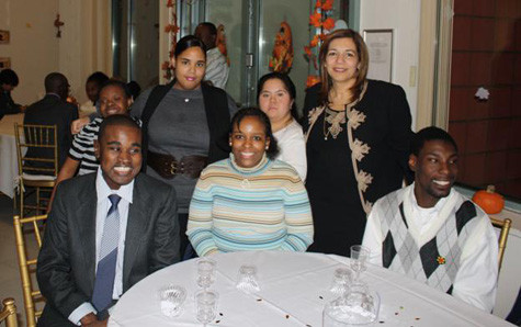 Courtesy Human First Inc.
Staff and residents of Human First enjoyed the Thanksgiving feast. Top row, from left, were Monique Rowe, Elizabeth Tendler, Ciha Cherrey and CEO Wafa Abboud. Seated, from left, were Ruel Davis, Elizabeth Lewis and Dominick Heath.