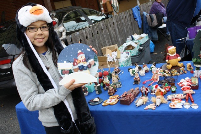 Emily Fuchs, 9, of Levittown, shopped outside at the German Holiday Market, held annually at the Plattduetsche Park Restaurant in Franklin Square.