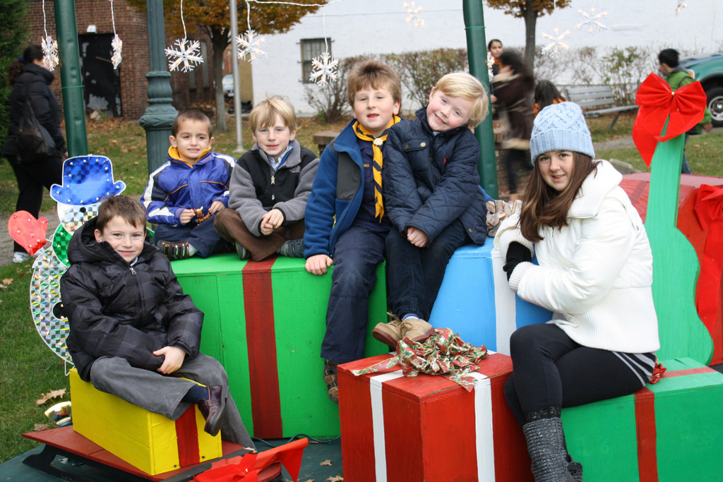 Tommy Atkinson, 6, Riley Curran, 4, Edghan Hughes, 5, Enda Hughes, 7, Sean Atkinson, 5, and Shannon Ryder, all of Lynbrook, waited for the tree lighting to begin during the village’s Winter Festival. Story, more photos, page 13.
