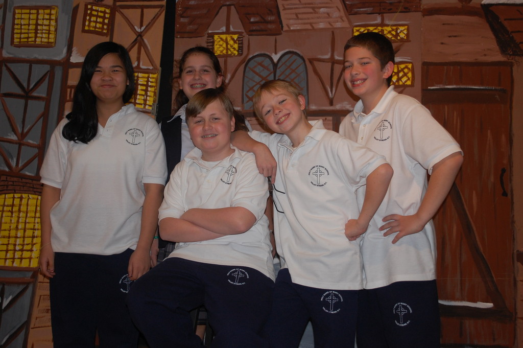 Playing leading roles in “A Christmas Carol” at Holy Name of Mary School are, from left, Jillian Manicdao, Deidre Kassebaum, Ryan Leighton, Matthew Donoghue and Kevin Glaittli.