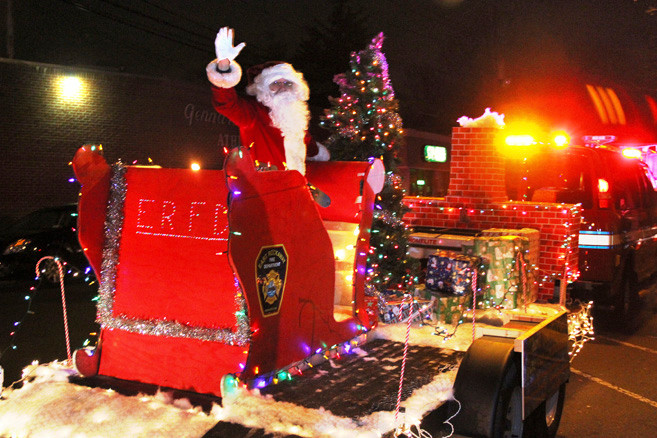 Santa arrived on his sleigh ­ — designed by members of the East Rockaway Fire Department.