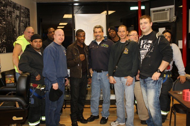 Richard Schriefer with the Elmont Fire Department, as well as Titus Williams, of Elmont.