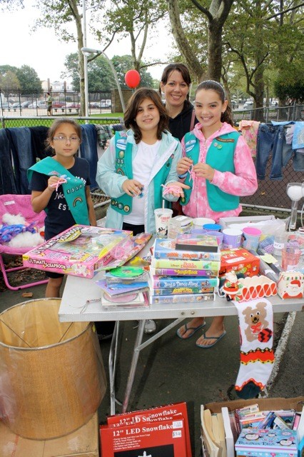 Jillian Pusateri, 10, left, Juliana Rigano, 10, Deirdre Occhino, 10, and Diane Turcic, leader of Troop 1359, had a booth at the event.