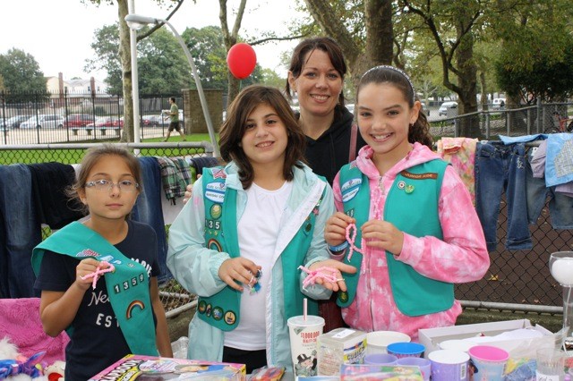Jillian Pusateri, 10, left, Juliana Rigano, 10, Deirdre Occhino, 10, and Diane Turcic, leader of Troop 1359, had a booth at the West Hempstead-Franklin Square Girl Scouts Association's third annual Big Backyard Sale on Oct. 1.