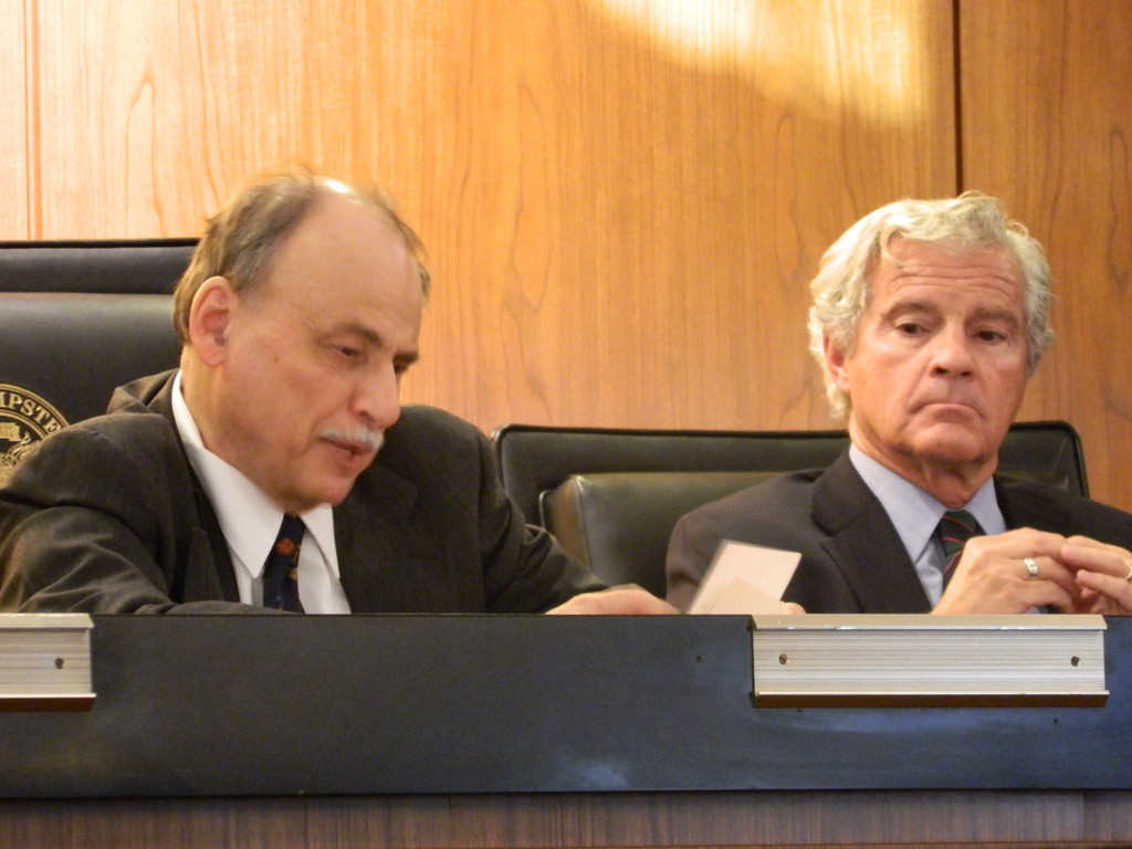 At a hearing last week, Public Service Commissioner James Larocca, right, and Administrative Law Judge Rafael Epstein heard from unhappy LIAW customers.