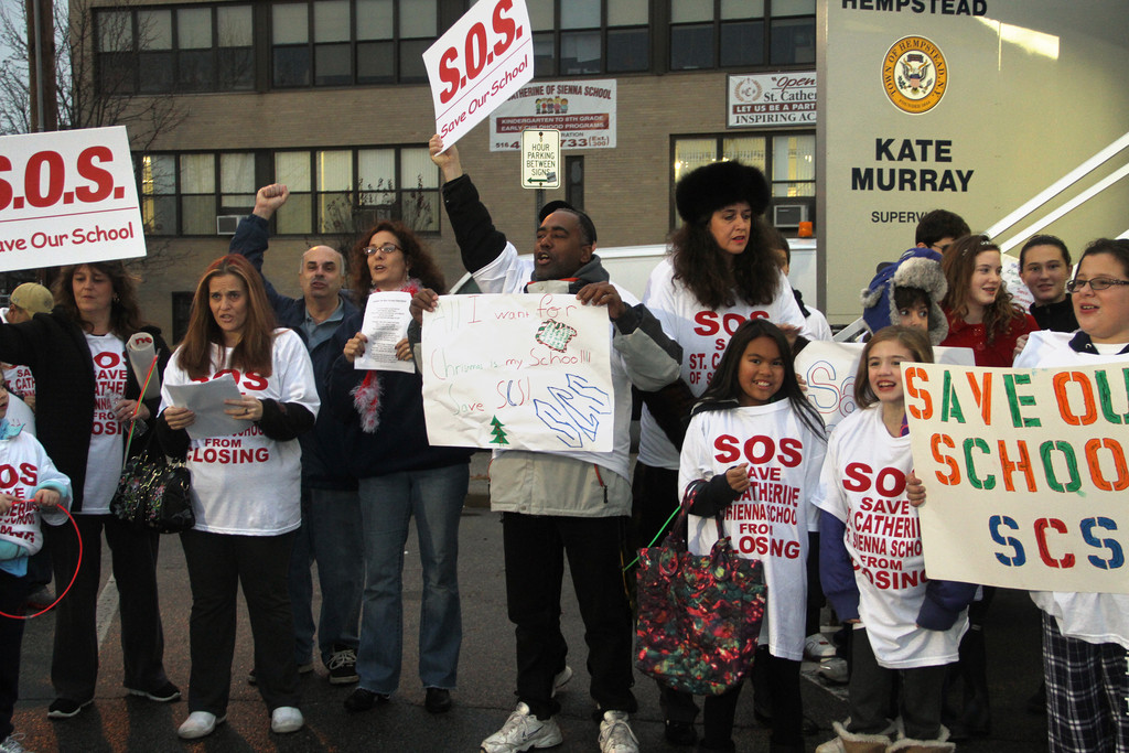 Parents and students from St. Catherine of Sienna Church in Franklin Square rallied against the school's closing last week.