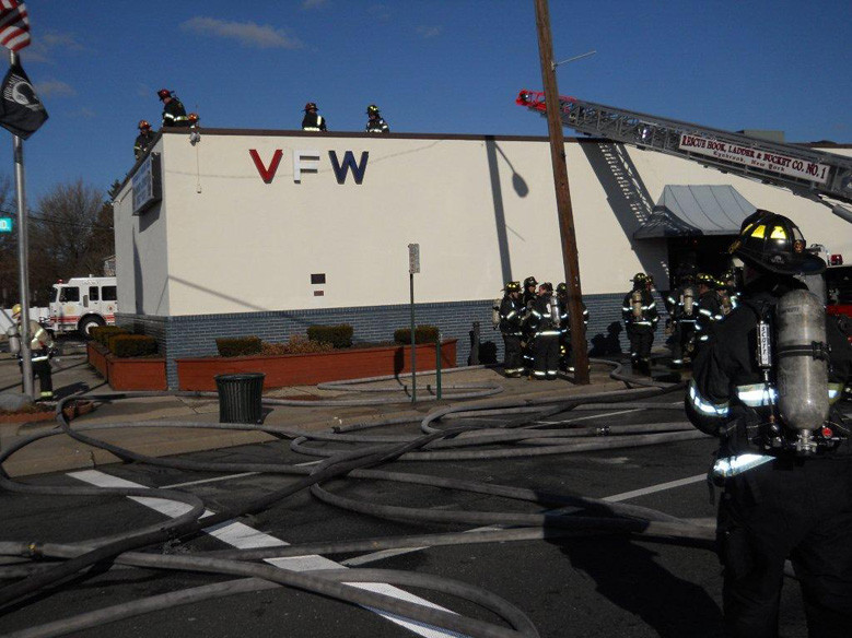 Firefighters check the damage after  attending to the fire at the Lynbrook VFW.