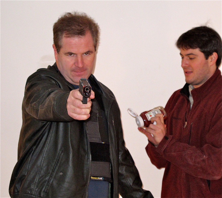 Gunfight, ketchup on the side. Actor Dan Brennan, left, co-star of the film “The Night Never Sleeps” prepped for a scene with some help with the fake blood from fellow actor/prop tech Russ Camarda. The scene, shot on School Road, was part of a project by filmmaker Fred Carpenter, who grew up in Baldwin and is back shooting in his former town.
