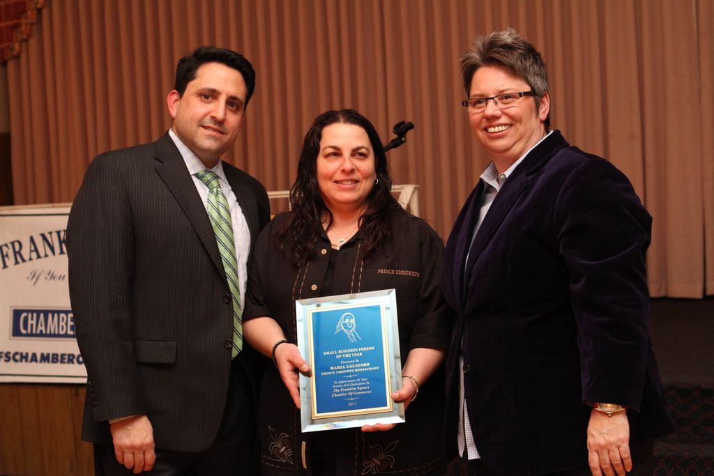 Mary Seifert, right, and new Franklin Square Chamber of Commerce President Joseph Ardito, left, honored Maria Caliendo, of Prince Umberto's, who was named the chamber's Business Owner of the Year for 2011.