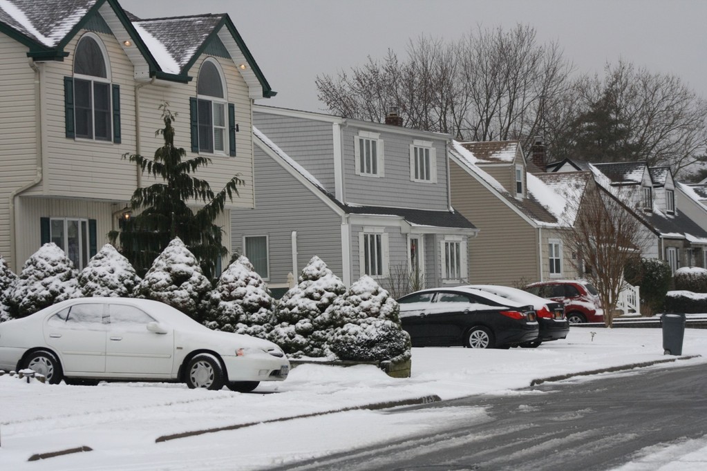 Homes were blanketed by snow on Saturday, on Marion Street in Franklin Square.
