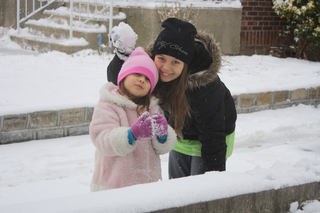 Franklin Square residents Sophia Papadoniou, 4, and her sister, LizAlexia Papadoniou, 10, were all smiles while playing in the snow on Jan. 22.
