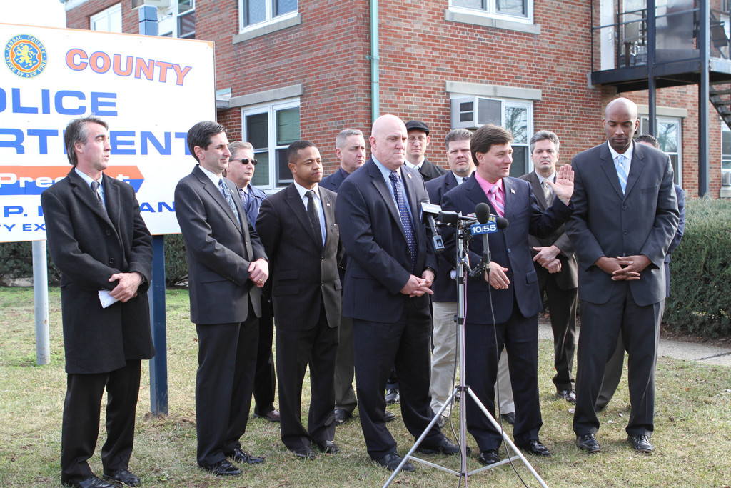 Legislators Dave Denenberg (District 19), Kevan Abrahams (District 1), Joseph Scannell (District 5), Wayne H. Wink Jr. (District 11) and Carrié Solages (District 3), as well as Nassau County PBA President James Carver, center, were among attendees of a rally on Jan. 31, regarding a county plan to transform four police precincts into Community Policing Centers.