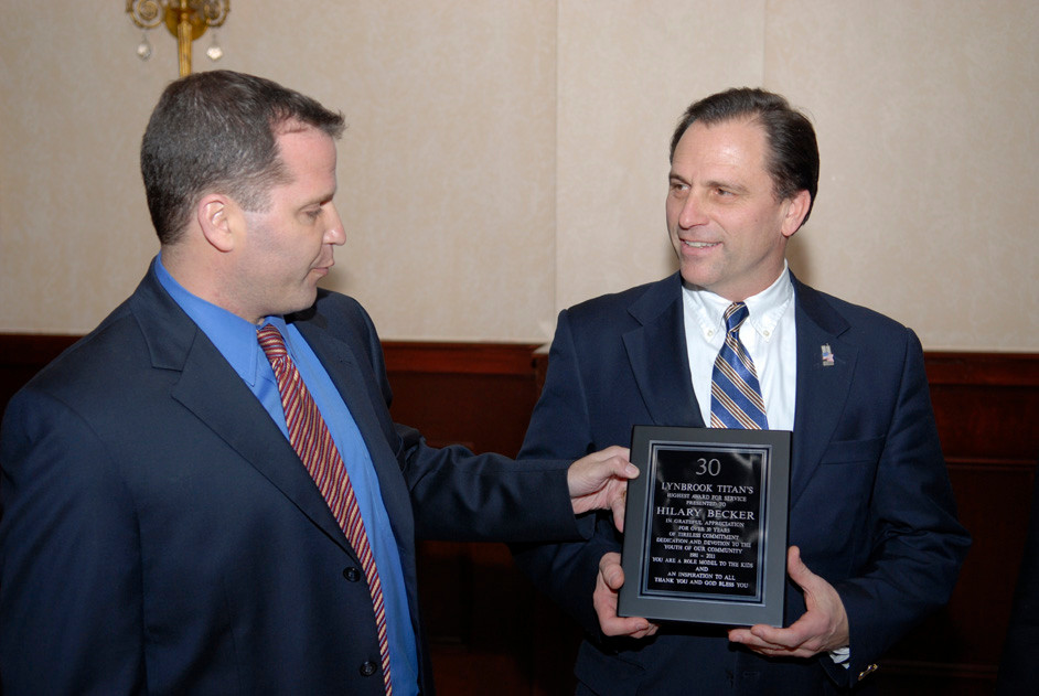 Matthew Shwom presented a plaque to Hilary Becker.