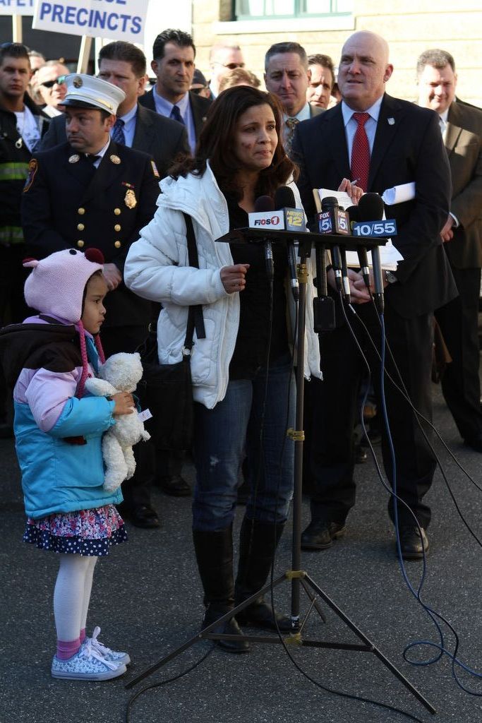 Milagros Vicente — with her daughter, Ariel — a Valley Stream 	resident who lives in the Fifth Precinct, spoke out against County Executive Ed Mangano’s plan to transform four Nassau police precincts into “community policing centers” on Monday.