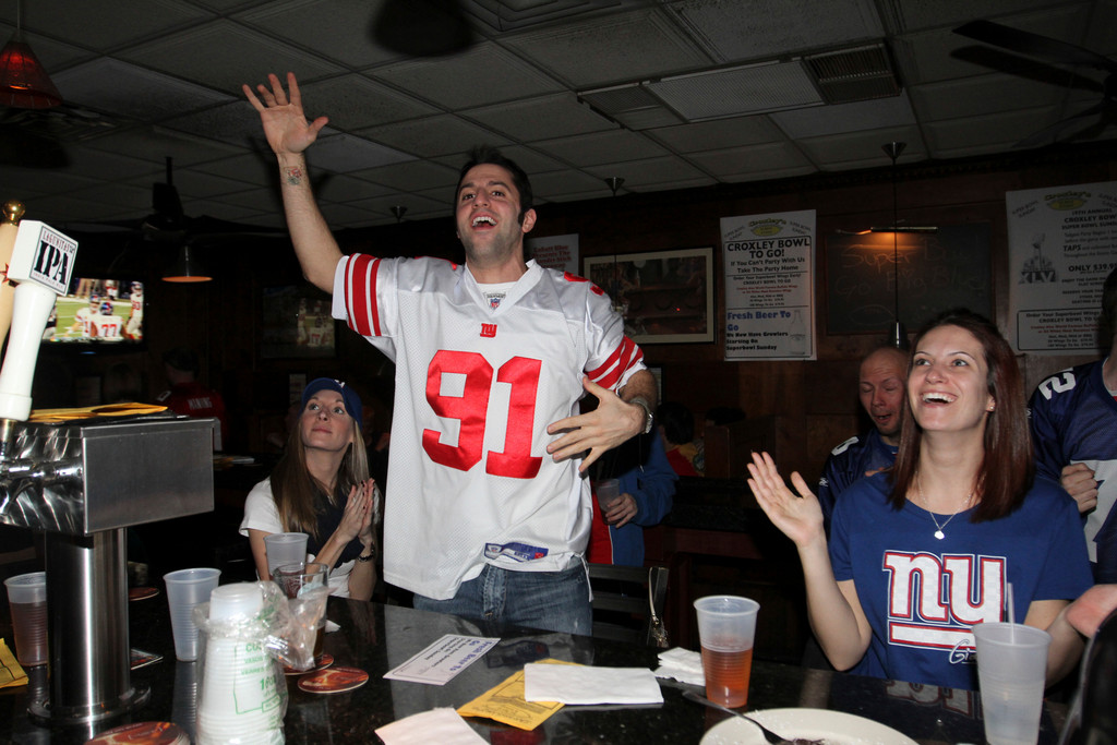 Tom Andreacchio, center, along with dozens of other New York Giants fans watched the Giants-New England Patriots Super Bowl XLVI game at Croxley’s Ale House in Franklin Square.