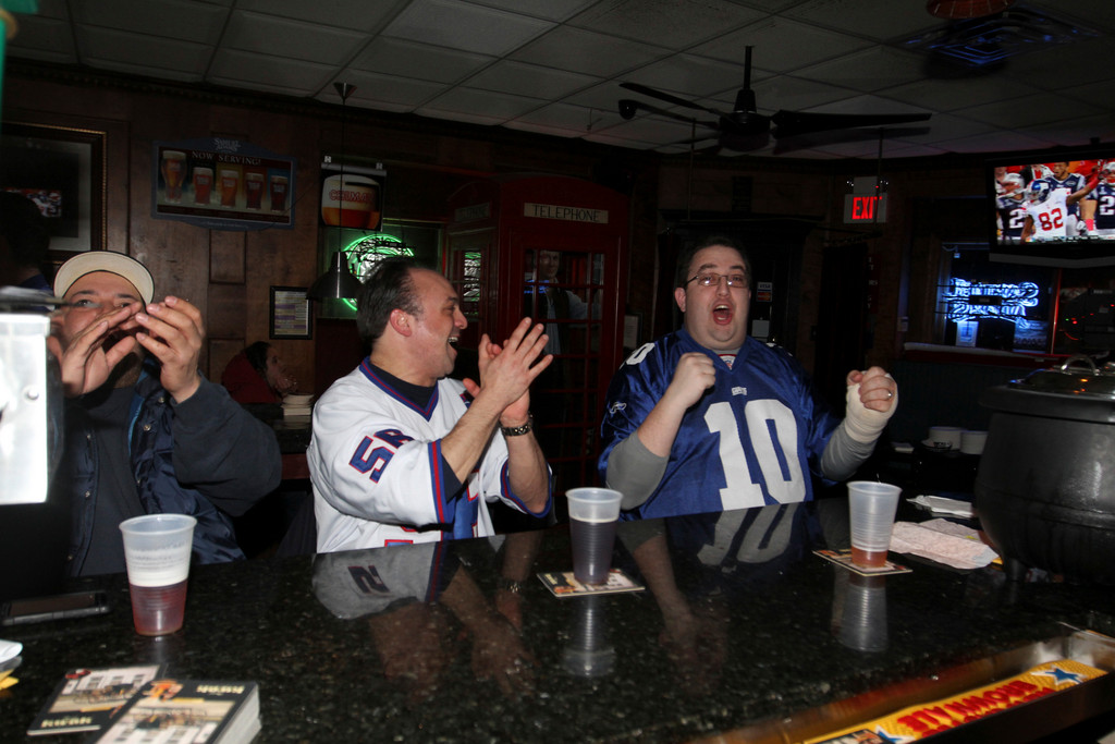 Radames Sanabria, left, Tom D’Angelo and Mike Frank cheered on the Giants.