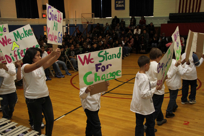 Gotham Avenue School fourth-graders marched with signs during an assembly to to celebrate the work of Dr. Martin Luther King Jr. last week.