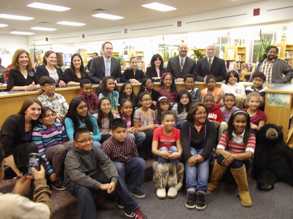 Students from District 30’s three elementary schools pose with board members, faculty and administration.