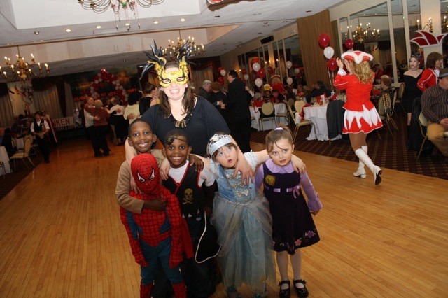 Lucrezia Lovce, center, of Elmont, danced with Karl Holle, left, 4, who was dressed as Spiderman; Moliere Philppe, 7, who was dressed as Indiana Jones; Jayden Philppe, 5, dressed as a pirate; and Hailey Shatesky, 5, dressed as Cinderella.