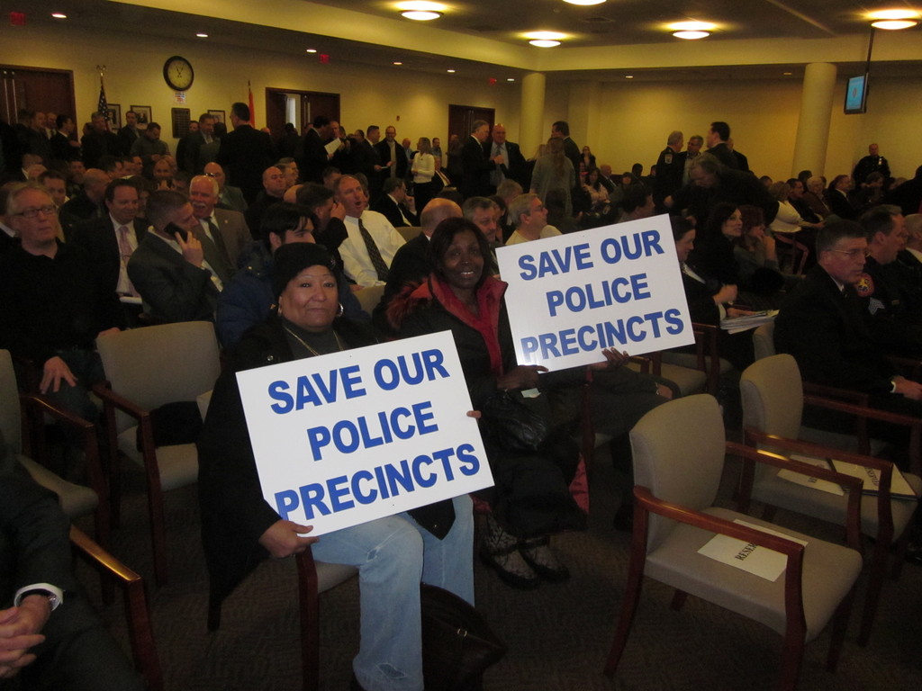 Regina Adolphus, left, of West Hempstead, and Tommi Smith, of Elmont, showed their disapproval of the police department’s realignment plan.