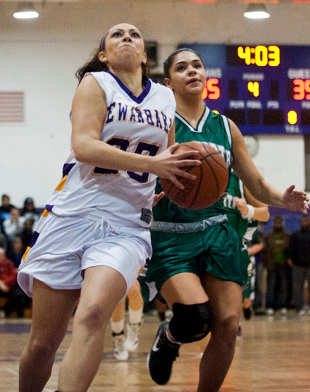 Sewanhaka's Jackie Wisniewski, left, charged towards the rim with Valley Stream North's Alexis Contreras in pursuit.