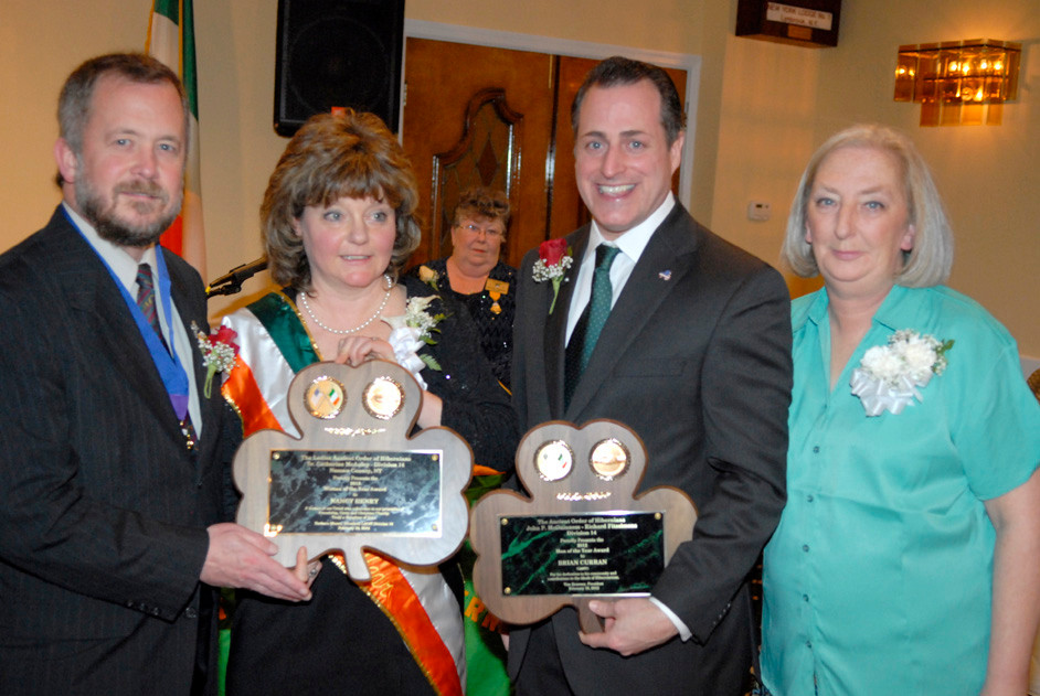 Event coordinators Jim Henry, left, and Pauline Johnson, right with recipients Nancy Henry and Brian Curran.