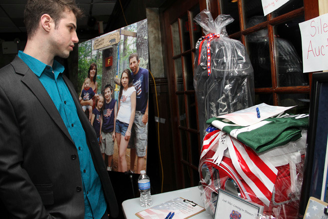 Jeff DeAnna checked out items in the silent auction at "Pack the 'Jim' Night," held in Franklin Square on Feb. 3.