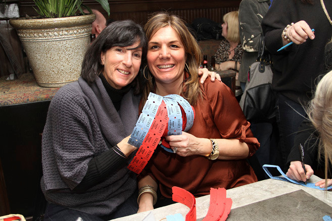 Event organizers Jill Mollitor, left, and Tia Albig, Tracy McGrath’s sister, volunteered at the fundraising event.