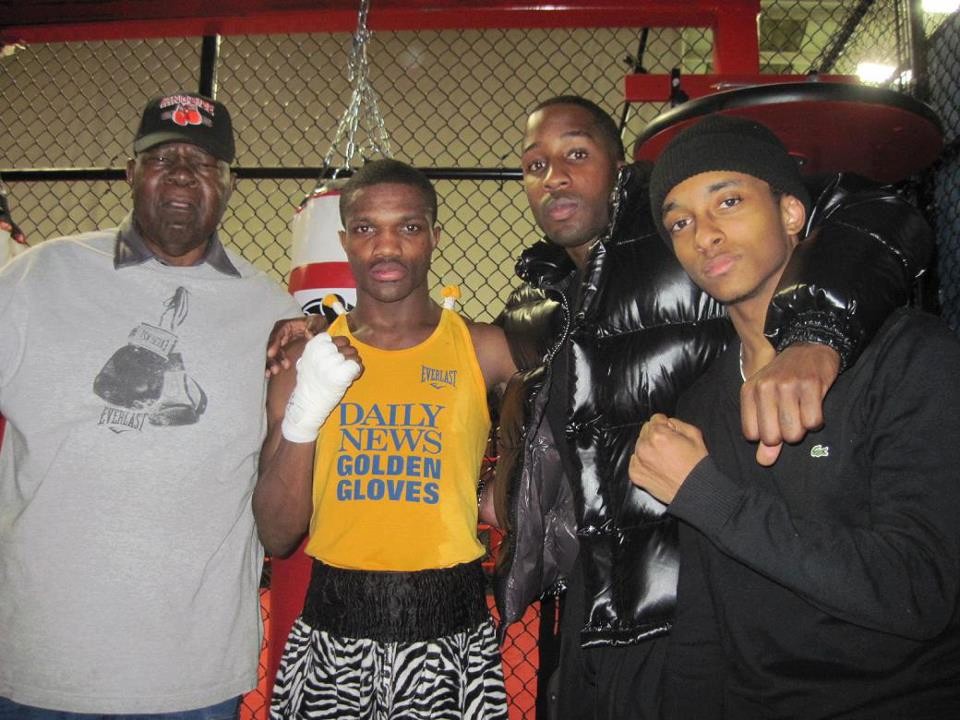 Local boxing coach Sam Jackson, left, Titus Williams, Herve Duroseau and Kaliym Quik Muhammad.