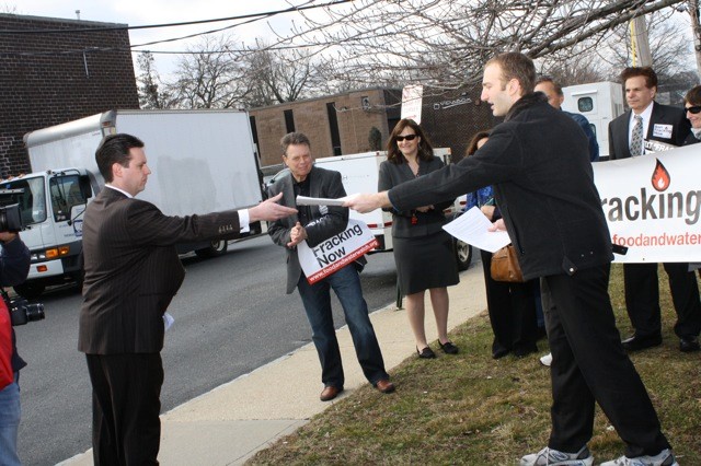 During a community event last week, Sam Bernhardt, a Long Island organizer for Food and Water Watch, handed over a pettition with more than 1,800 signatures — asking Sen. Jack Martins (R-Mineola) to support a legislative ban on fracking — to Justin Burke, chief of staff for Martins.
