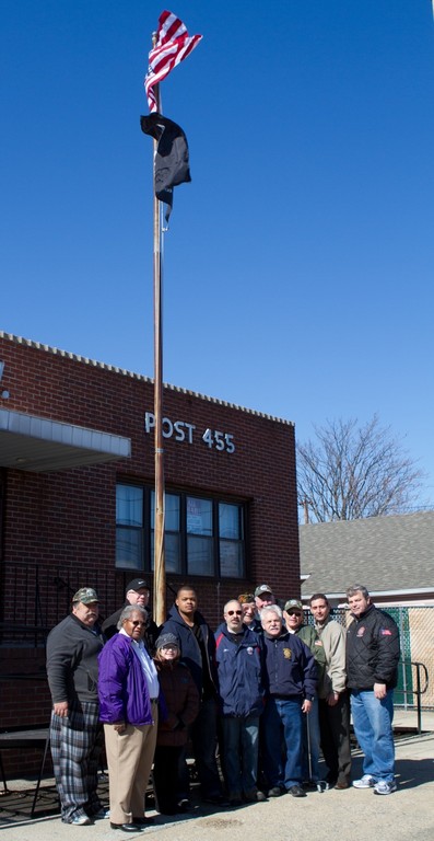 Local residents, including Bill Garnett, Muzzio Tallini, Tom Bennet Jr. and Frank Hrbek, stood in front of a new American flag that was raised — at the VFW Post 455 in Elmont — last week.