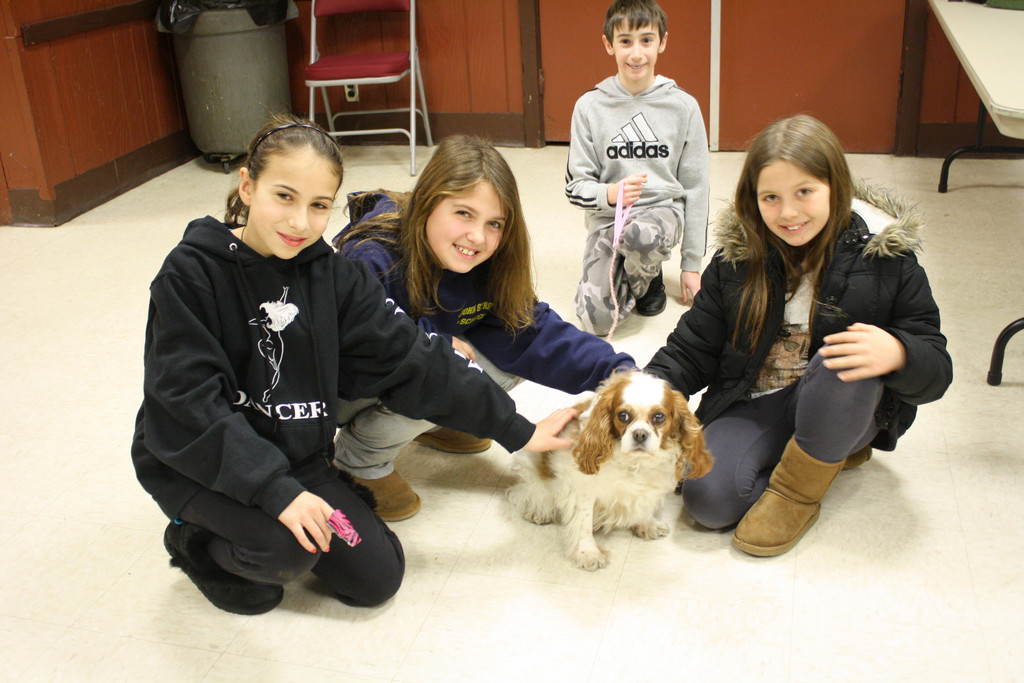 Franklin Square residents Breanna Grotta, 10, left, Amanda Prescott, 10, Chris Lucchesi, 10, Victoria (dog), and LizAlexia Papadoniou, 10, were all smiles during Brusca's animal-safety event.