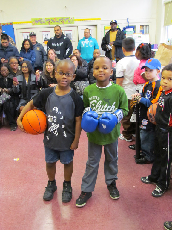 Clara H. Carlson second-graders Curtis Casimir, left, and Daniel Mathur dressed up as Kareem Abdul-Jabbar and Muhammad Ali for a Black History Month commemoration event at the school in February.