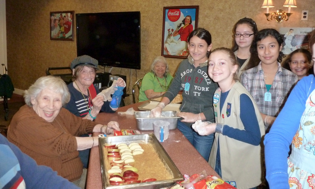 Atria Lynbrook residents Florence Rovetti, far left, and Anita Jacobs welcomed members of Girl Scout Troop 2297 to a cooking class celebrating the publication of Atria Assisted Living’s new cookbook, “A Dash and a Dollop.” Rovetti is one of five Atria Lynbrook residents whose recipes are featured in the national organization’s publication. Story, more photos, page 17.