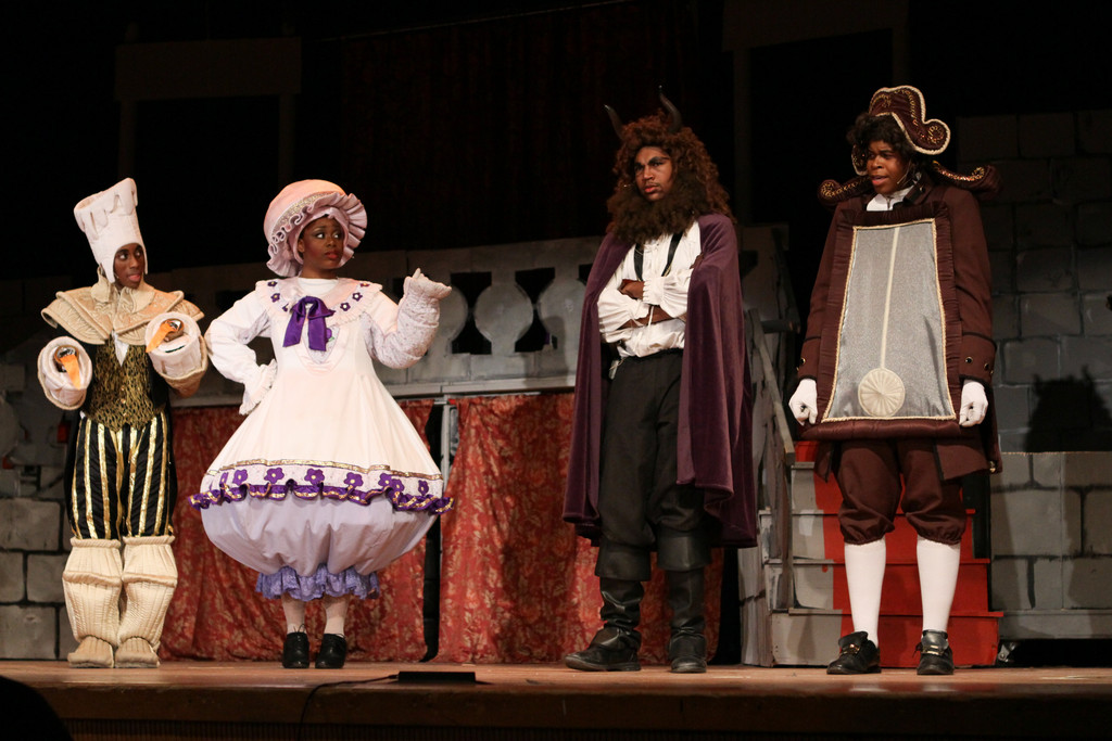 Kourdell Young, left, played Lumiere; Phylisha Mitchell played Mrs. Potts; Zachary Chung Cogsworth performed as the Beast; and Chris Braithwaite performed as the Enchanted Mantle Clock.