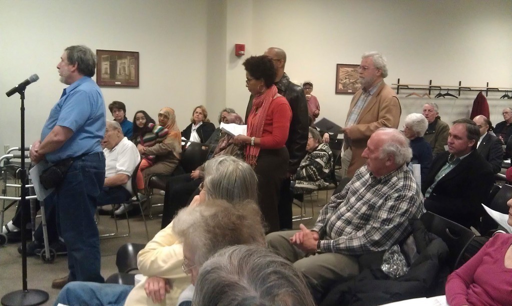 Concerned residents waited in line to speak to library board members about their plan to close the library’s two branches.