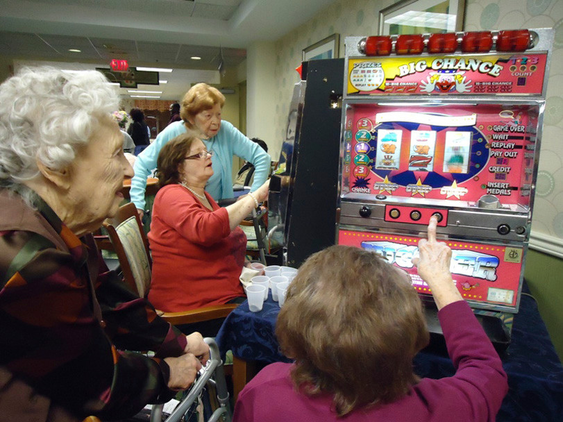 Joan Brennan takes a chance at the slot machine. Also pictured were Celia Arum, Linda Walsh and Zelda Terkeltoub.