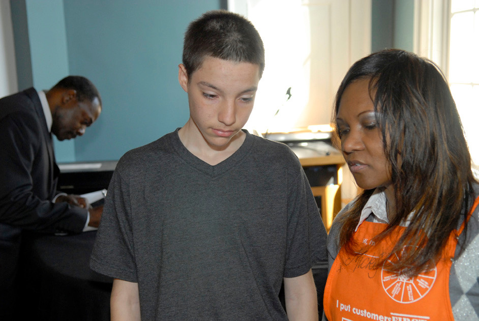 Lynbrook High School sophomore Gavin Kuster, 15, spoke with Michaelle Tulloch, from The Home Depot, about summer job opportunities.