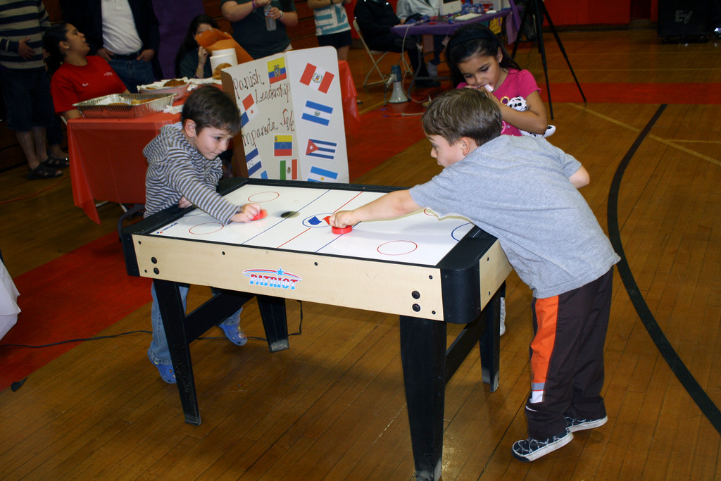 Franco Visone, 4, of Oceanside, and Rosario Parrino, 4, of Franklin Square, battled on the  air hockey table during the event.