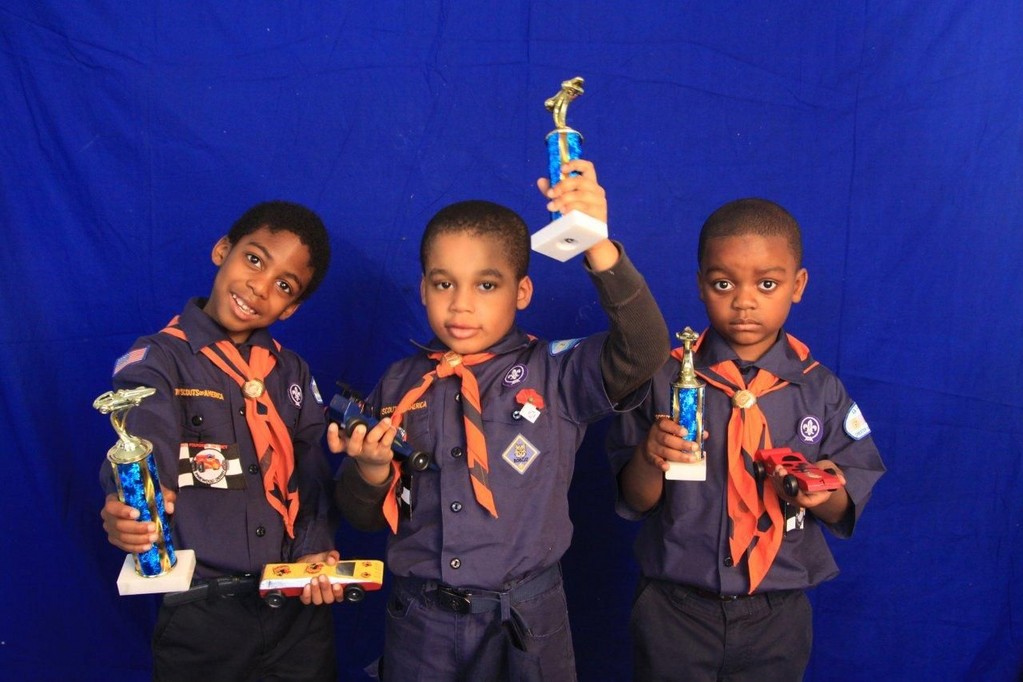 Pack 263 Cub Scout Joshua Dixon, left, of Elmont, placed first among Cub Scout Tigers at the Grand Prix Pinewood Derby on March 10. Devon Reid of St. Albans, a member of Pack 316, placed second, and Brandon Francis of Laurelton, a Pack 263 member, placed third.