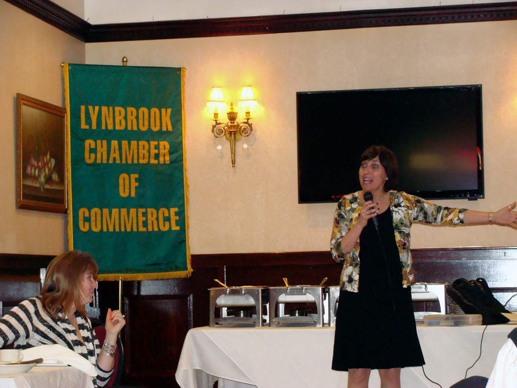 Motivational business speaker Randi Busse talked about customer service to Lynbrook business owners.