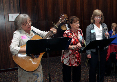 Any Dattner-Levy, left, Sylvia Dultz and Vivian Blumstein lead the women in singing “The Journey Song.”