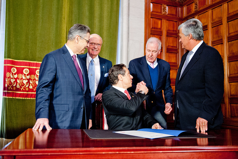 Assembly Speaker Sheldon Silver, left, Sen. Hugh Farley, Sen. Kemp Hannon and Senate Majority Leader Dean Skelos watched as Gov. Cuomo signed the 2012-13 New York State budget.