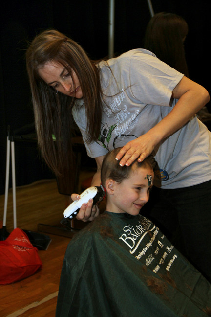 Michael Deutsch had his head shaved by Grace Jennings.